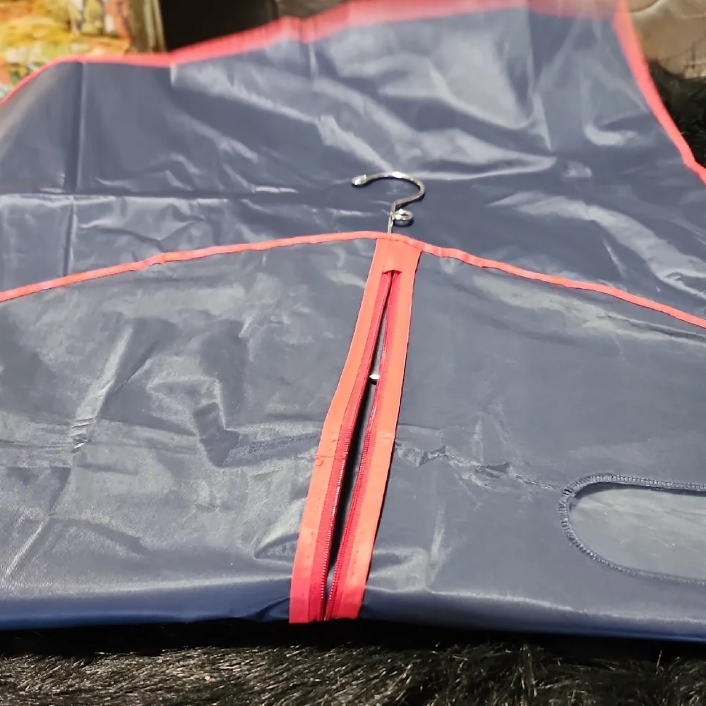 Navy Garment Bag with Red Trim. Silver Hanger Included.
